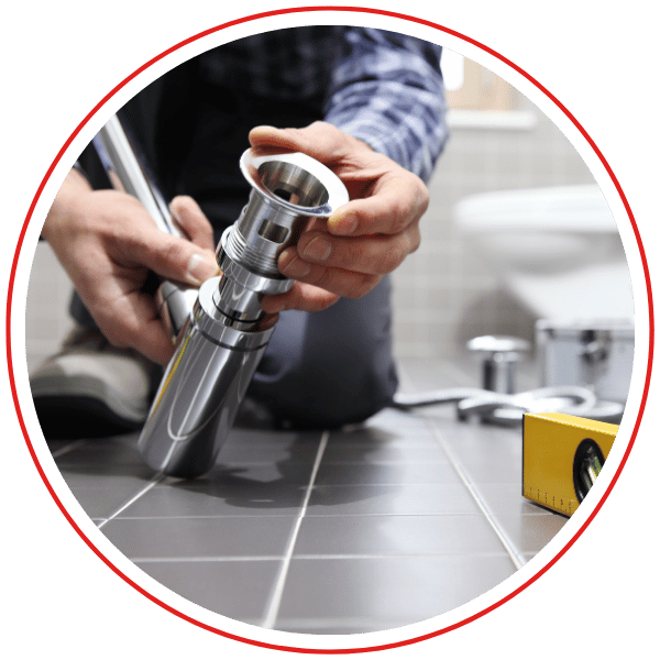 plumber puts flange on drain pipe