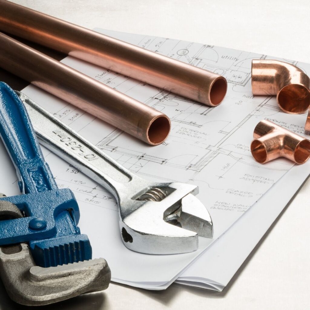 plumbing tools and a floorplan